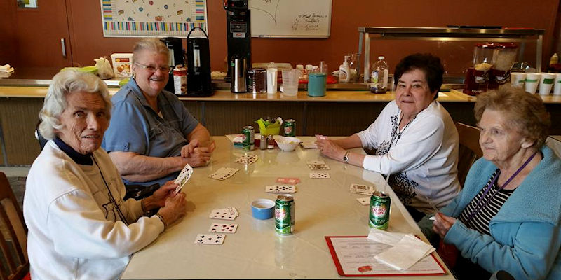 Residential Home residents enjoy a card game